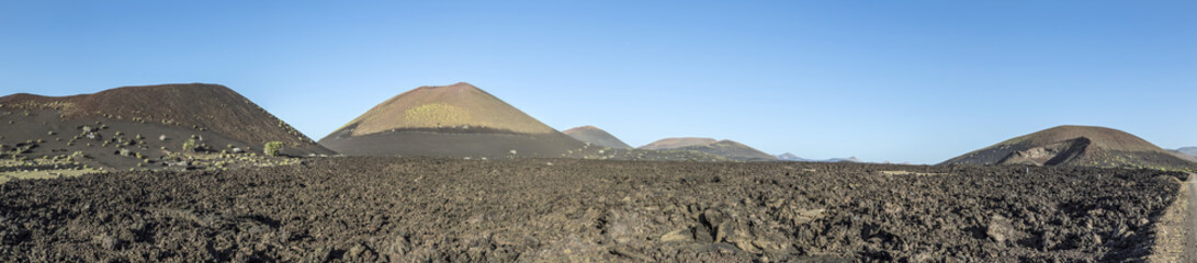 Fototapeta na wymiar volcanos in Timanfaya national park near Mancha Blanca