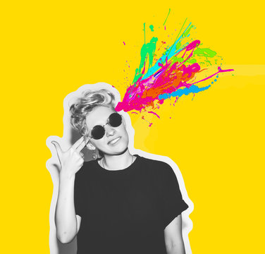 Magazine style collage headshot portrait of rocky emotional woman blow mind with finger gun gesture, brain explosion of colors. Mind brain blowing concept. Fun fashion blonde girl in rock sunglasses.
