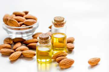 cosmetic set with almond oil on table background