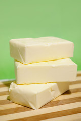 Butter in briquettes on a chopping board