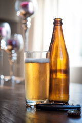 beer bottles and a glass on a table