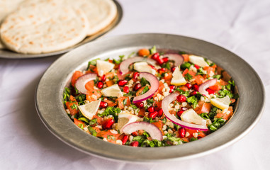 Tabbouleh salad against white background. Selective focus.