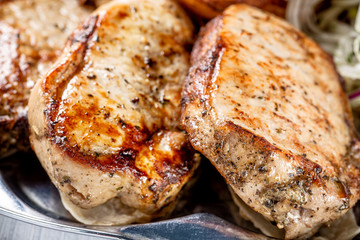 Juicy grilled meat pieces close up with selective focus