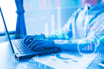 The people working laptop in home office graph of stock market trade indicator financial. Profit graph of stock market trade indicator financial.Double exposure style 