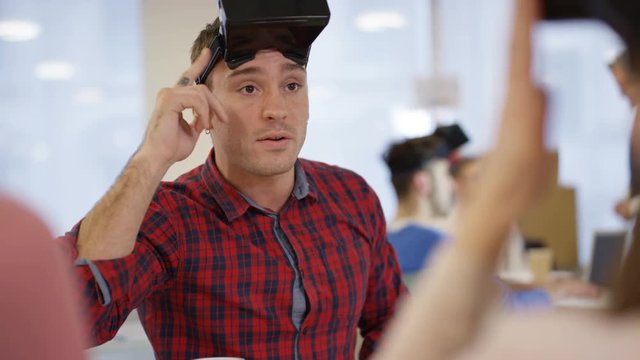 Young computer programmers trying out virtual reality viewers