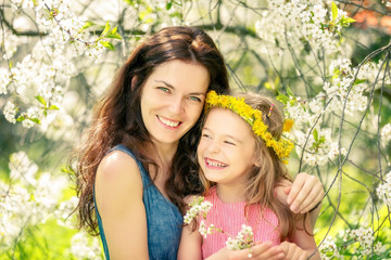 Mother and daughter in spring cherry dlossom park