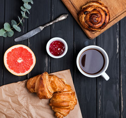Delicious breakfast with croissants and jam