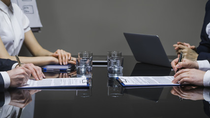 Businessmen signing contracts