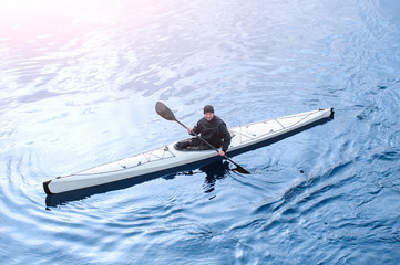 Kayaking on the river in the city near the shore 06