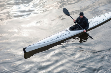 Kayaking on the river in the city near the shore 07