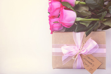 Brown Paper gift and pink roses.