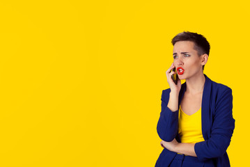 Angry frustrated woman talking on phone looking to copy space isolated yellow background wall. Negative human emotion, face expression