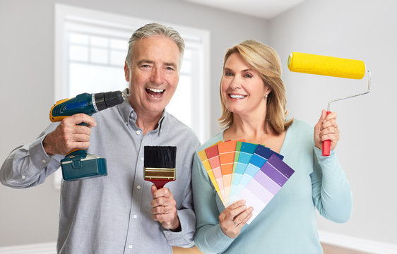 Senior Couple With Drill And Painting Roller