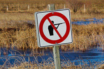 No Hunting sign along a nature path