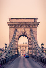 Cars Drive Over the Historic Chain Bridge in Budapest