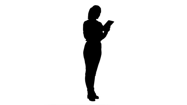 Silhouette Businesswoman standin with digital tablet and working.