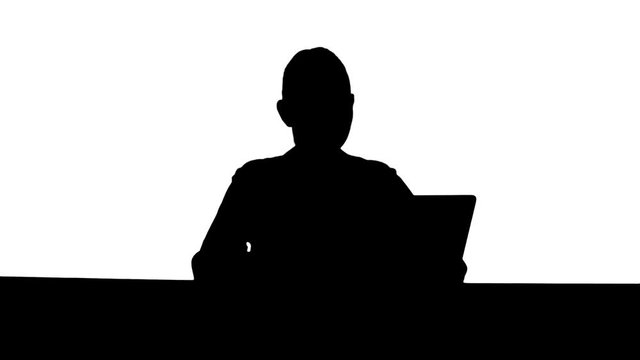 Silhouette Positive businesswoman ready to work on laptop computer at the begining of day.