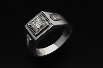 Diamond ring on black background