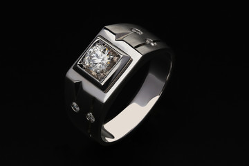 Diamond ring on black background