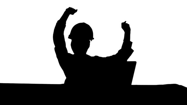 Silhouette Female chief engineer celebrate a successful finish of project, smiling.