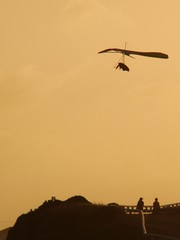 Hang glider enjoyig the sunset from up high