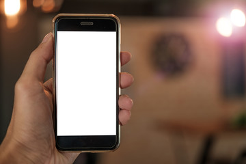man holding smart phone with blank mobile can be add your texts or others. at cafe coffee shop with...