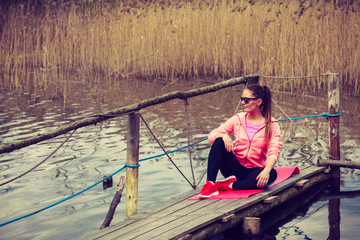  Young sports woman taking break after a run.