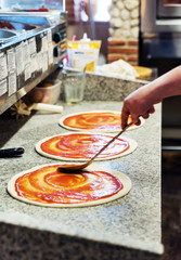 chef making pizza