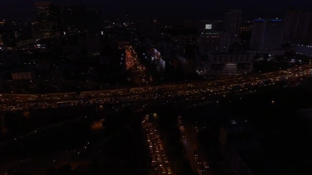 Bangkok city traffic on elevated road aerial view shot at dusk