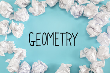 Geometry text with crumpled paper balls