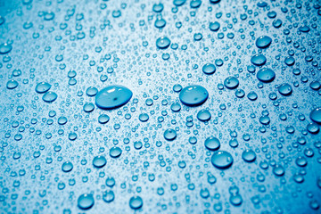 Water drops on blue background.