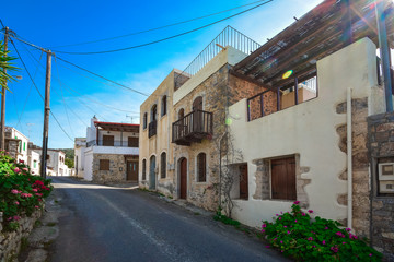 Fototapeta na wymiar A nice traditional neighborhood with old stone houses at Milatos, Crete, Greece.