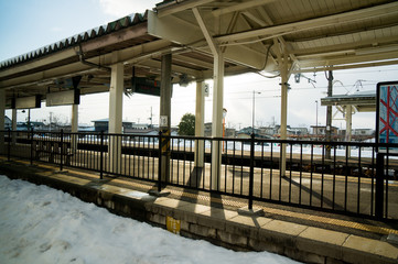 Fototapeta premium An evening train station lonely in the winter. No people.
