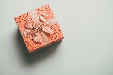 gift box with ribbon viewed from top isolated on gray color background.