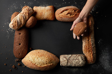 Different kinds of bread on background