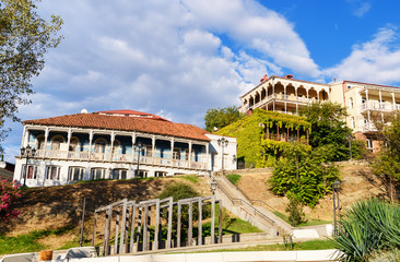 Fototapeta premium Buildings with colorful carved wooden balcony, in Balkony. Georgia.