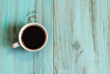 A cup of coffee, espresso on a wooden background. View from above.