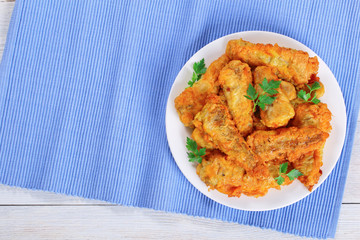 delicious golden batter fried perches on plate