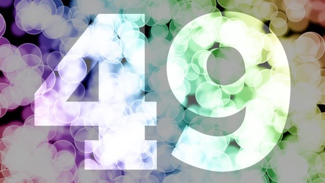 Forty nine to fifty years birthday fade in/out animation with color gradient moving bokeh background. Animation: 90 frames still with number, 180 fade out, 30 clear, 180 fade in, 300 still.
