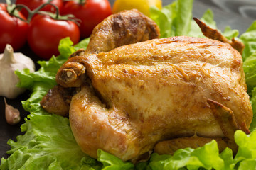 baked chicken on lettuce leaves