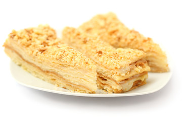 cake napoleon on plate isolated on white background