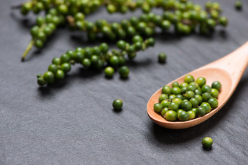 Fresh green pepper on dark background.