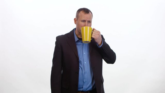 Medium Shot Of A Man Taking A Sip Of Coffee That Tastes Bad On White Background.