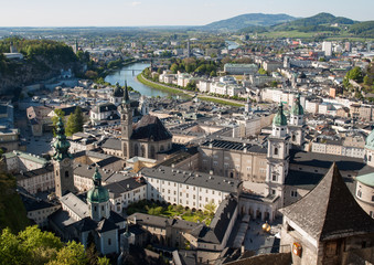 Fototapeta premium Top view of the Salzach river and the old city in center of Salzburg, Austria, from the walls of the fortress / Festung Hohensalzburg /