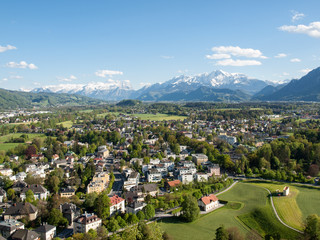 Fototapeta na wymiar Aerial panoramic view from the top of Hohensalzburg fortress (Castle) on Alps. Salzburg, Austria