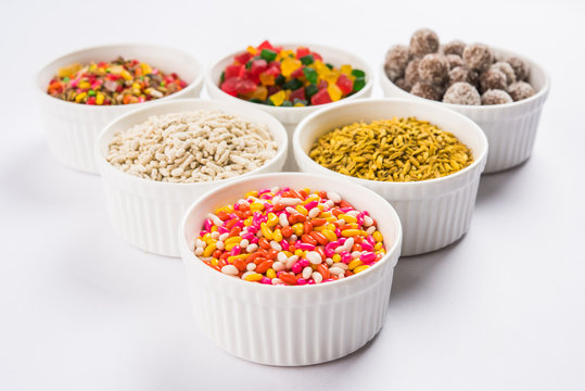 Indian traditional mouth freshener like sauf, chatpata gatagat, mixed supari, tutti frutti used in sweet Masala Paan etc served in white ceramic bowls, selective focus 