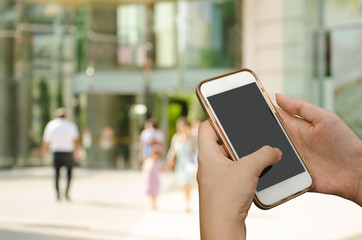 Woman using mobile smartphone at business area