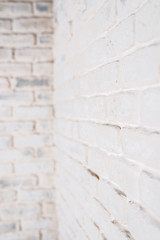 Abstract vertical white background. The corner of the brick wall.