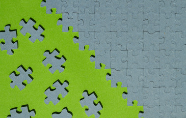 jigsaw puzzle piece cut out on green background
