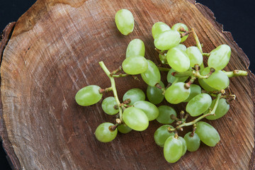 Grapes on the wooden background